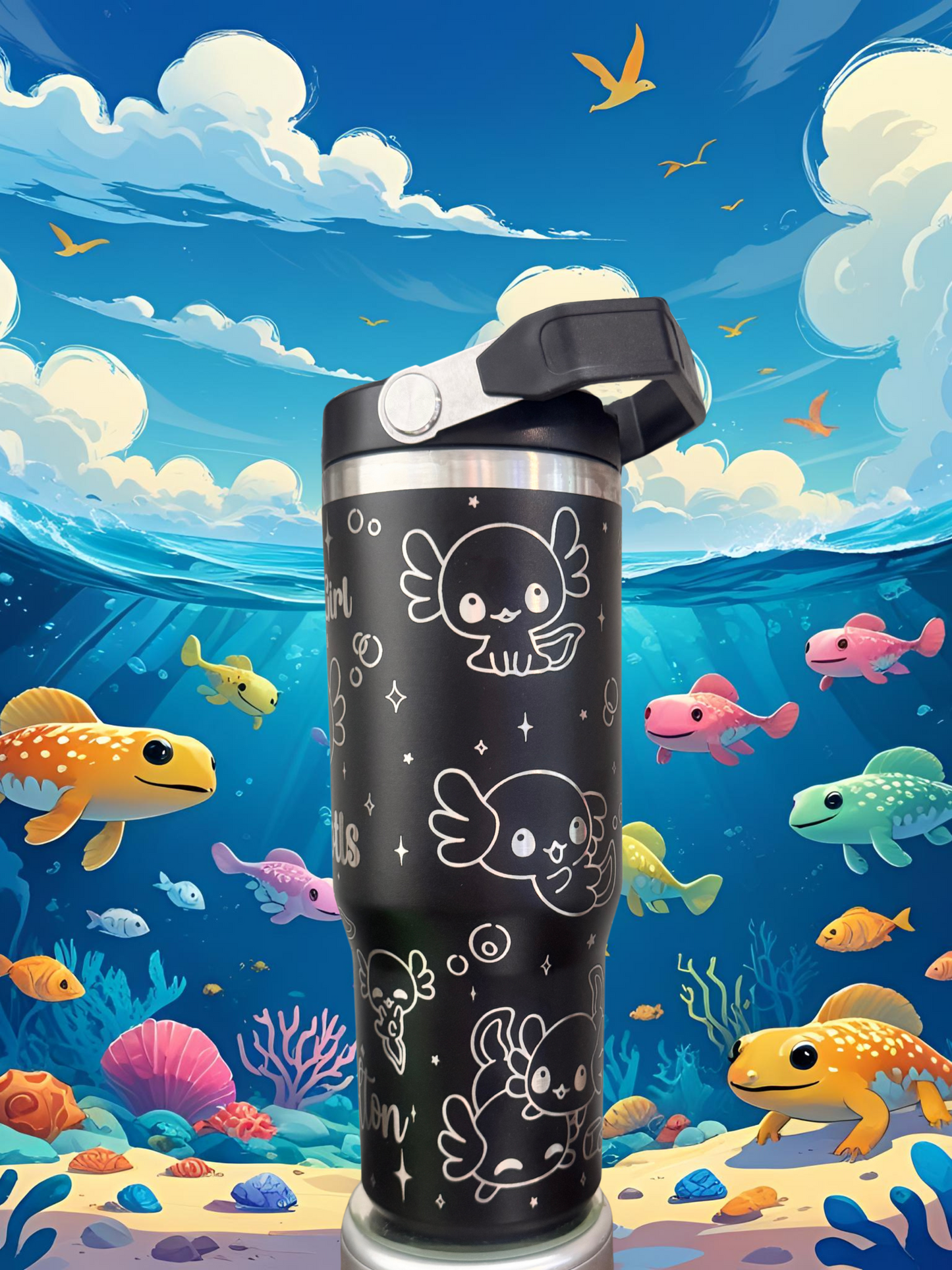 A black tumbler with a whimsical design featuring cartoon-style fish and sea creatures, set against a vibrant underwater scene with colorful fish and coral.