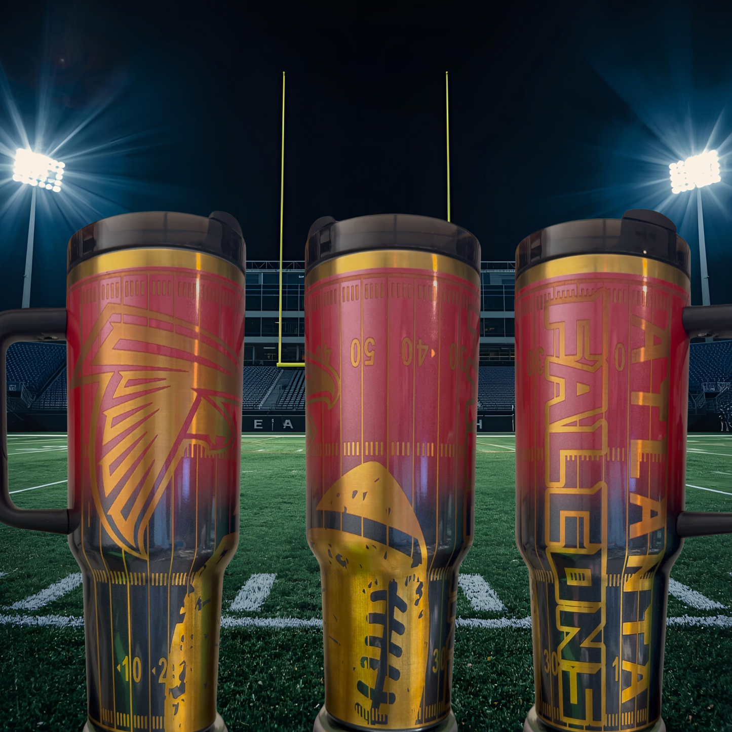 Three large, colorful tumblers with football designs on them, placed on a football field at night with stadium lights in the background.