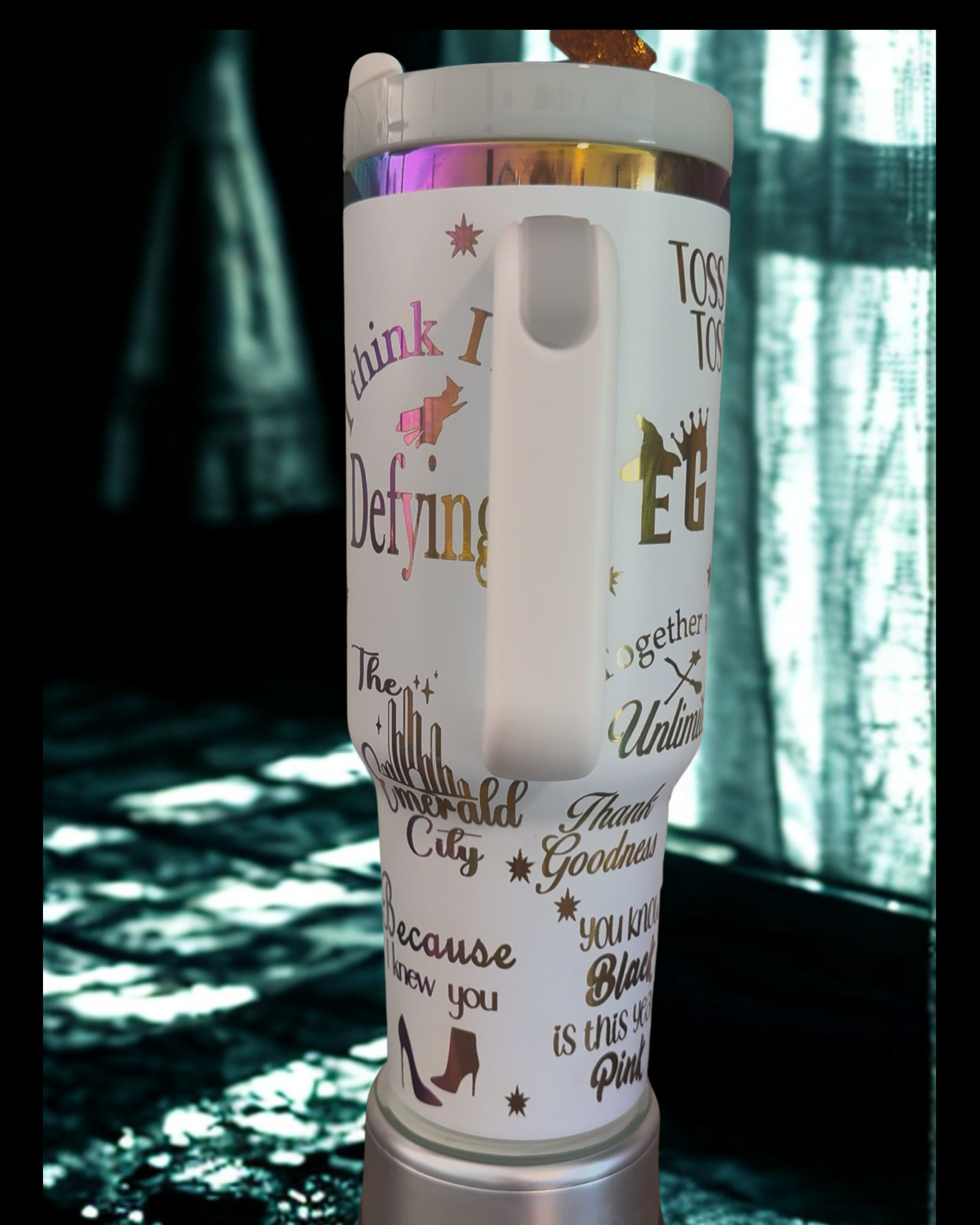 A white thermos mug with various phrases and words printed on it, including "Think I Defying", "The Star-Shaped City", "Thank goodness", "Because you know", "Blast is this year", and "Tossed to the City".