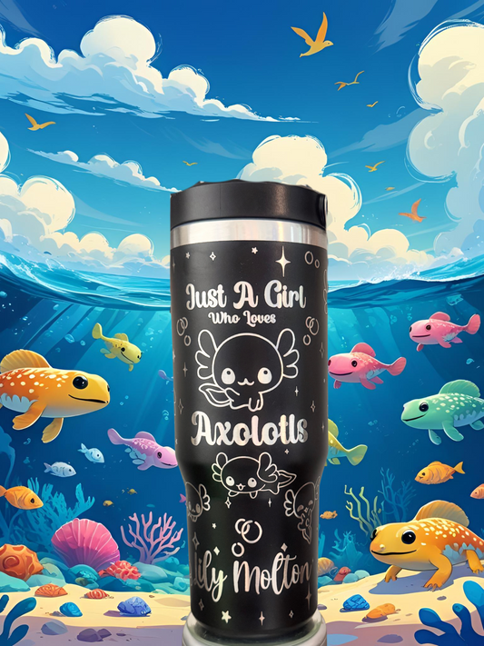 A black tumbler with a whimsical design featuring a cartoon axolotl surrounded by colorful fish and coral, set against a vibrant underwater scene.